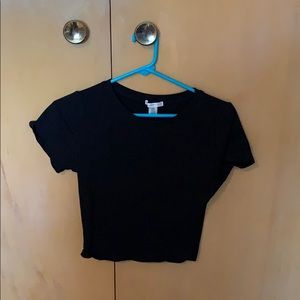 A plain black cropped tee